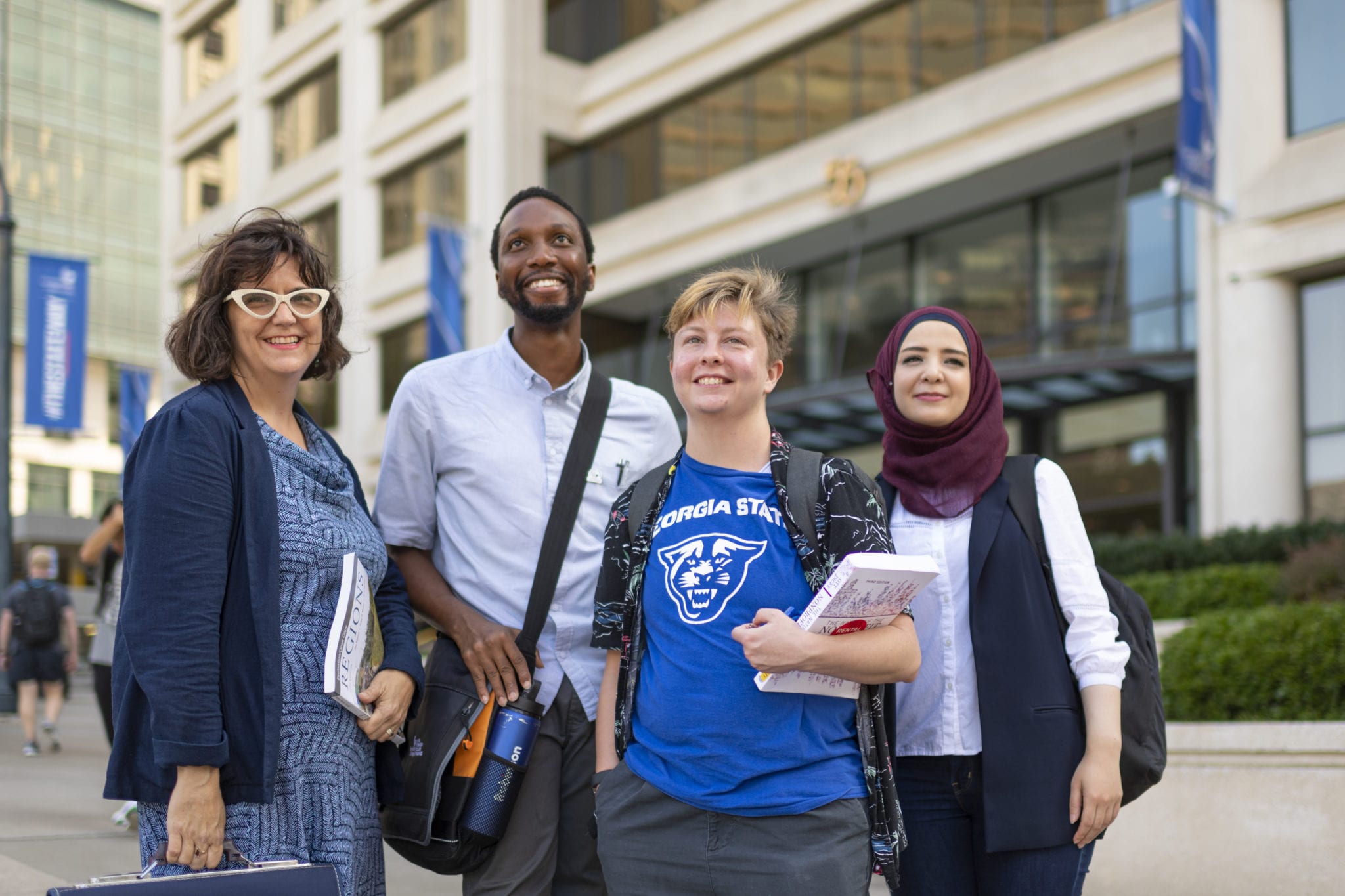 Students and faculty outside Georgia State University's Andrew Young School of Policy Studies